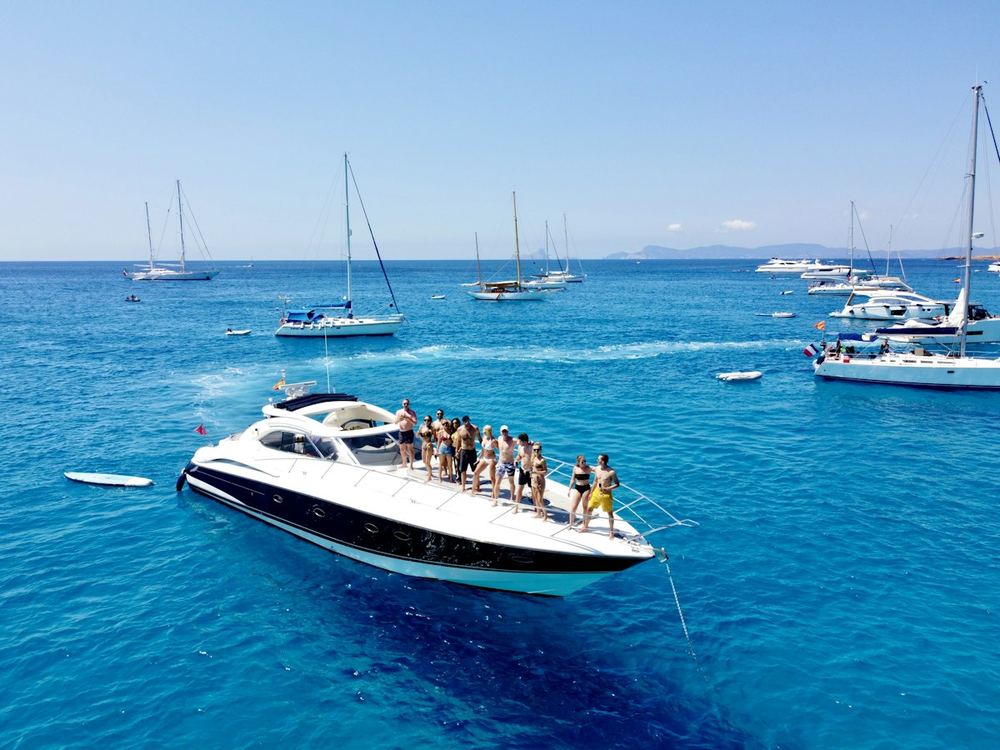 People on the bow of a yacht at sea