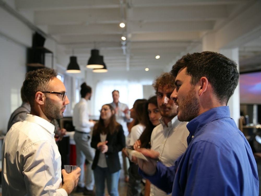 Founders talking at a mixer