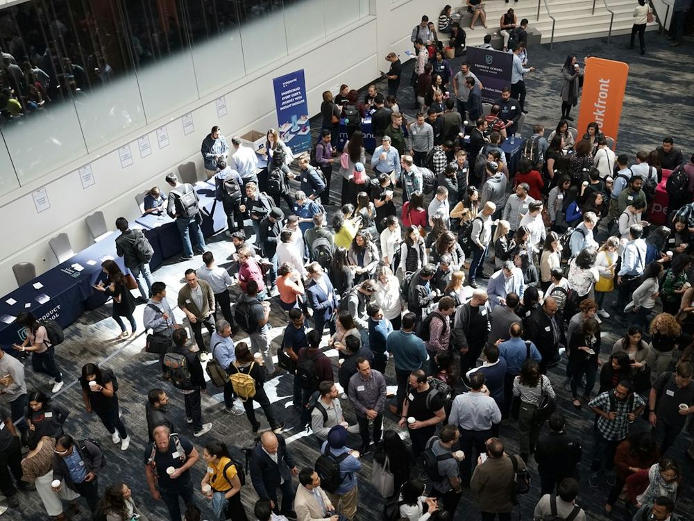 A crowd at a large trade show